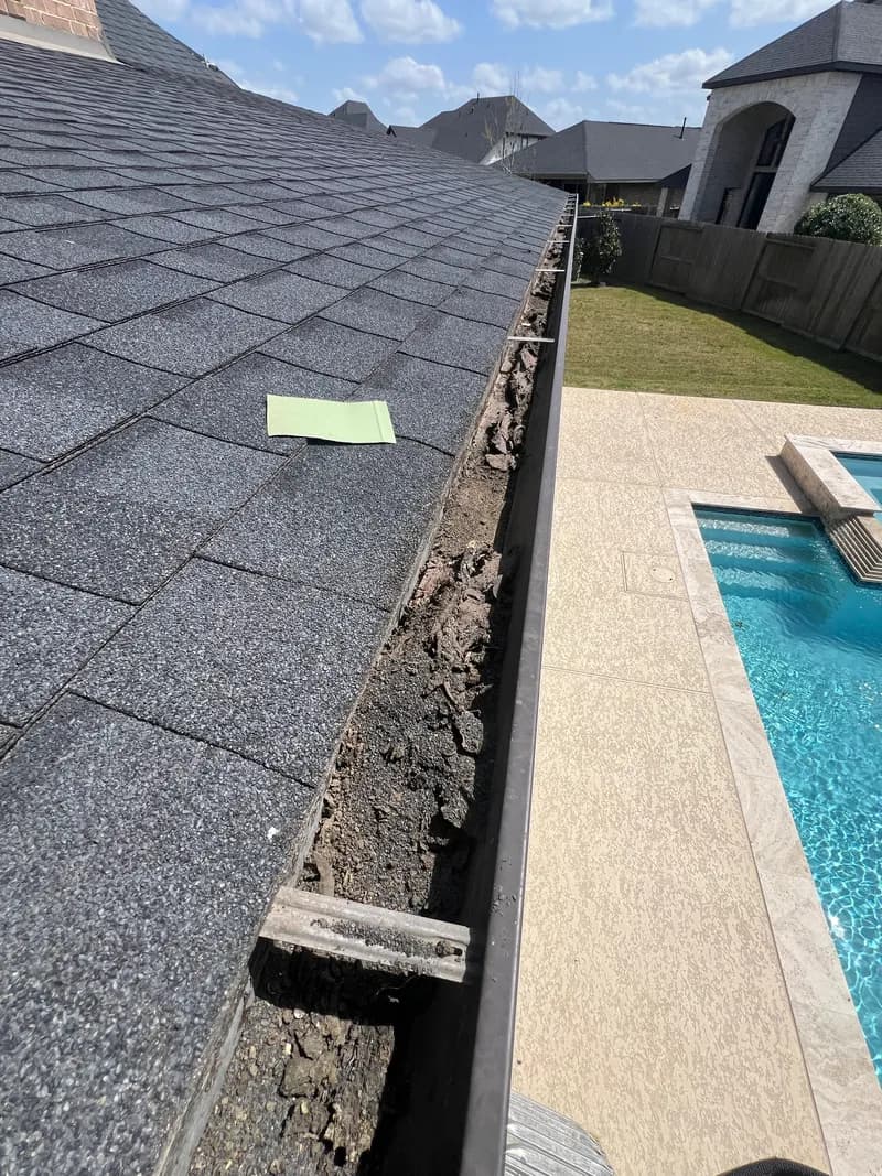 Inspector evaluating a commercial gutter system