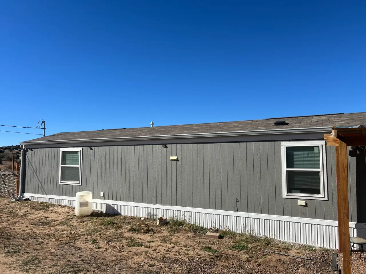 Single-story home with a new gutter along the roofline